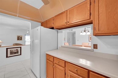 This second-floor unit in Hidden Woods of Deer Creek is a prime on Deer Creek Golf Club in Florida - for sale on GolfHomes.com, golf home, golf lot