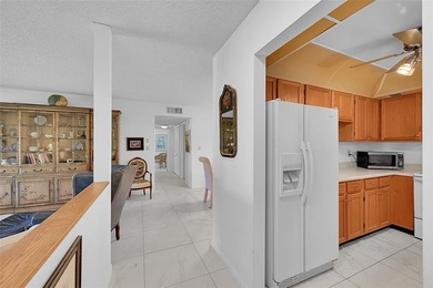 This second-floor unit in Hidden Woods of Deer Creek is a prime on Deer Creek Golf Club in Florida - for sale on GolfHomes.com, golf home, golf lot