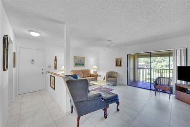 This second-floor unit in Hidden Woods of Deer Creek is a prime on Deer Creek Golf Club in Florida - for sale on GolfHomes.com, golf home, golf lot