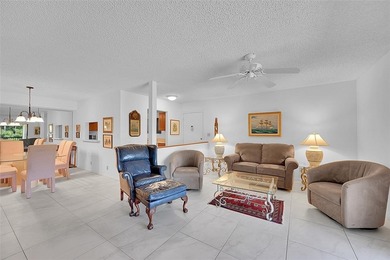 This second-floor unit in Hidden Woods of Deer Creek is a prime on Deer Creek Golf Club in Florida - for sale on GolfHomes.com, golf home, golf lot