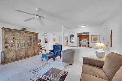 This second-floor unit in Hidden Woods of Deer Creek is a prime on Deer Creek Golf Club in Florida - for sale on GolfHomes.com, golf home, golf lot