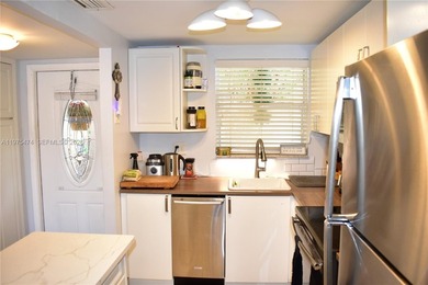 This first floor corner unit is facing the largest lake in on Sunrise Lakes Phase III in Florida - for sale on GolfHomes.com, golf home, golf lot