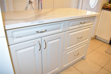 This first floor corner unit is facing the largest lake in on Sunrise Lakes Phase III in Florida - for sale on GolfHomes.com, golf home, golf lot