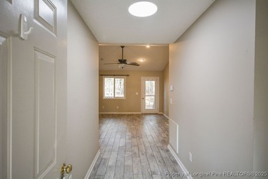 Welcome Home to Carolina Lakes! This charming 3-bedroom, 2-bath on Carolina Lakes Country Club in North Carolina - for sale on GolfHomes.com, golf home, golf lot