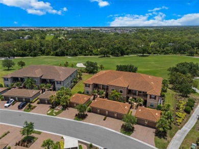 Experience refined living in this elegant second-floor residence on Esplanade Golf and Country at Lakewood Ranch in Florida - for sale on GolfHomes.com, golf home, golf lot