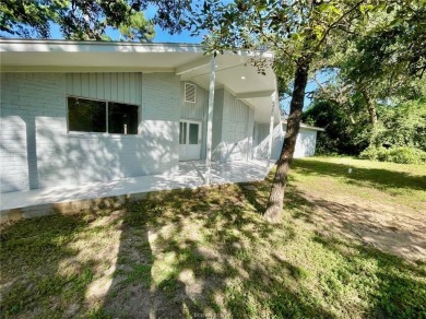 Wow!  Hard to find a mid-century modern-inspired home on a on Hilltop Lakes Resort Golf Club in Texas - for sale on GolfHomes.com, golf home, golf lot