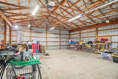 Welcome to 13660 18 Mile Rd., Gowen - a peaceful country retreat on The Links of Bowen Lake in Michigan - for sale on GolfHomes.com, golf home, golf lot