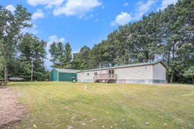 Welcome to 13660 18 Mile Rd., Gowen - a peaceful country retreat on The Links of Bowen Lake in Michigan - for sale on GolfHomes.com, golf home, golf lot