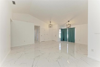Discover the perfect blend of comfort, style, and convenience in on Palm Aire Country Club of Sarasota in Florida - for sale on GolfHomes.com, golf home, golf lot