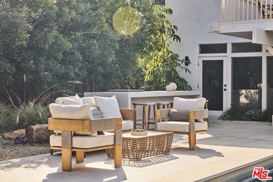 Tucked behind the guarded gates of the exclusive Malibu Colony on Calabasas Golf and Country Club in California - for sale on GolfHomes.com, golf home, golf lot