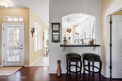 Enjoy stunning water views and abundant natural light in this on Viera East Golf Club in Florida - for sale on GolfHomes.com, golf home, golf lot