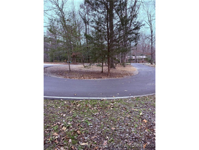 Wooded lot, perfect for building in a quiet cul de sac on Carolina Trace Country Club in North Carolina - for sale on GolfHomes.com, golf home, golf lot