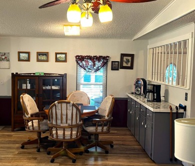 Discover the charm of this exceptional property, featuring:    - on Lake Henry Golf Club in Florida - for sale on GolfHomes.com, golf home, golf lot