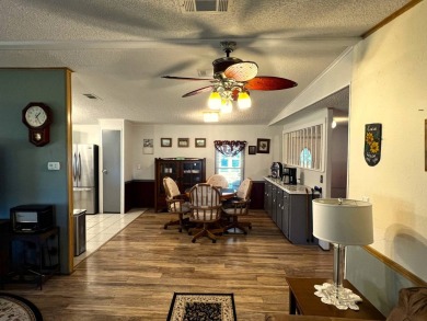 Discover the charm of this exceptional property, featuring:    - on Lake Henry Golf Club in Florida - for sale on GolfHomes.com, golf home, golf lot