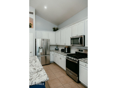 Looking for a semi-custom 2-story home located in an upscale on Dave White Reg Park and Golf Course in Arizona - for sale on GolfHomes.com, golf home, golf lot