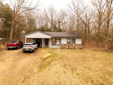 Discover the charm of this 2-bedroom, 1-bath home in the on Cherokee Village North Course in Arkansas - for sale on GolfHomes.com, golf home, golf lot