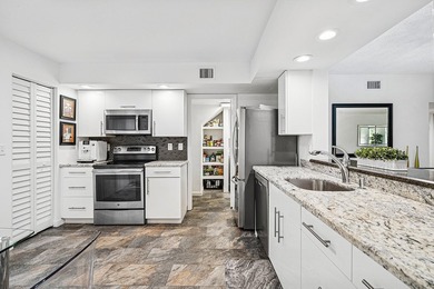 Look at this beautiful first-floor condo with a private garage on Boca Pointe Country Club in Florida - for sale on GolfHomes.com, golf home, golf lot