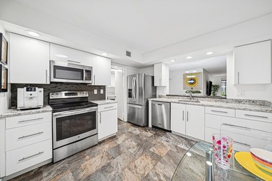 Look at this beautiful first-floor condo with a private garage on Boca Pointe Country Club in Florida - for sale on GolfHomes.com, golf home, golf lot