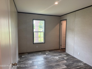 Welcome to this breathtaking, open-concept Modern home built on Brookridge Country Club in Florida - for sale on GolfHomes.com, golf home, golf lot