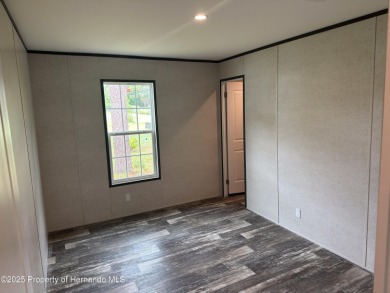 Welcome to this breathtaking, open-concept Modern home built on Brookridge Country Club in Florida - for sale on GolfHomes.com, golf home, golf lot