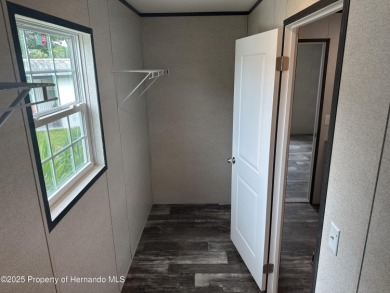 Welcome to this breathtaking, open-concept Modern home built on Brookridge Country Club in Florida - for sale on GolfHomes.com, golf home, golf lot