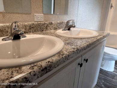 Welcome to this breathtaking, open-concept Modern home built on Brookridge Country Club in Florida - for sale on GolfHomes.com, golf home, golf lot