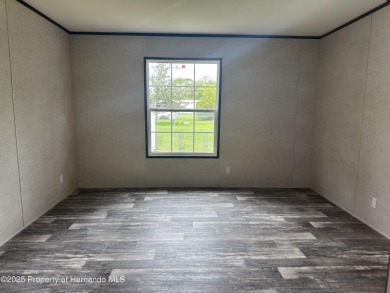 Welcome to this breathtaking, open-concept Modern home built on Brookridge Country Club in Florida - for sale on GolfHomes.com, golf home, golf lot