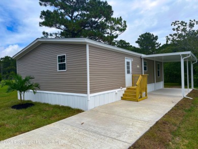 Welcome to this breathtaking, open-concept Modern home built on Brookridge Country Club in Florida - for sale on GolfHomes.com, golf home, golf lot