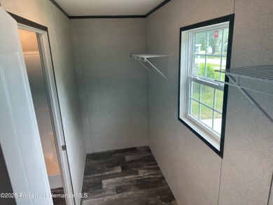 Welcome to this breathtaking, open-concept Modern home built on Brookridge Country Club in Florida - for sale on GolfHomes.com, golf home, golf lot