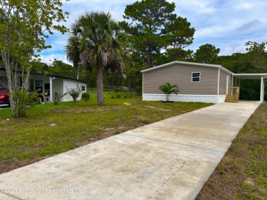 Welcome to this breathtaking, open-concept Modern home built on Brookridge Country Club in Florida - for sale on GolfHomes.com, golf home, golf lot