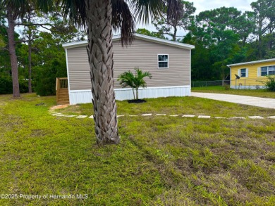 Welcome to this breathtaking, open-concept Modern home built on Brookridge Country Club in Florida - for sale on GolfHomes.com, golf home, golf lot