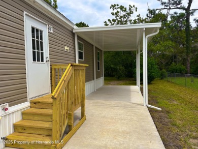 Welcome to this breathtaking, open-concept Modern home built on Brookridge Country Club in Florida - for sale on GolfHomes.com, golf home, golf lot