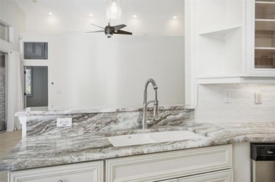 Nestled in Village Oaks of Grand Haven, this Mediterranean style on Grand Haven Golf Club in Florida - for sale on GolfHomes.com, golf home, golf lot