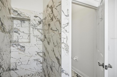 Nestled in Village Oaks of Grand Haven, this Mediterranean style on Grand Haven Golf Club in Florida - for sale on GolfHomes.com, golf home, golf lot