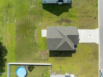 Designed with family living in mind, this home has a thoughtful on Ayden Golf and Country Club in North Carolina - for sale on GolfHomes.com, golf home, golf lot