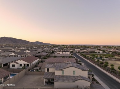 Enjoy panoramic mountain views and Phoenix skyline sunrises from on Verrado Golf Club  in Arizona - for sale on GolfHomes.com, golf home, golf lot