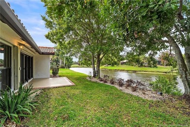 Welcome to this lovely villa set on a peaceful lake in the on Martin Downs Country Club in Florida - for sale on GolfHomes.com, golf home, golf lot