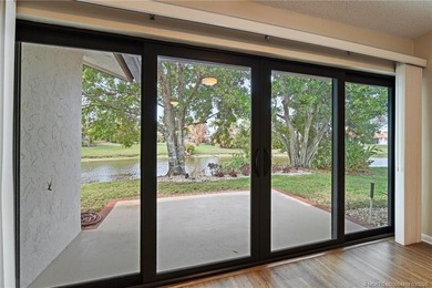 Welcome to this lovely villa set on a peaceful lake in the on Martin Downs Country Club in Florida - for sale on GolfHomes.com, golf home, golf lot