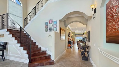 Welcome to an extraordinary Mediterranean-inspired estate on ChampionsGate Golf Resort in Florida - for sale on GolfHomes.com, golf home, golf lot