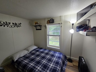 TIRED OF SKY-HIGH RENT? SAY HELLO TO YOUR AFFORDABLE ESCAPE! on Lakes of the North Deer Run Golf Course in Michigan - for sale on GolfHomes.com, golf home, golf lot