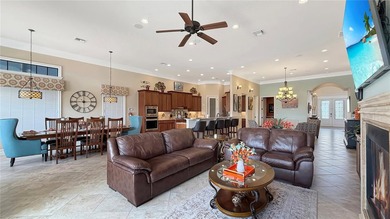 Welcome to an extraordinary Mediterranean-inspired estate on ChampionsGate Golf Resort in Florida - for sale on GolfHomes.com, golf home, golf lot