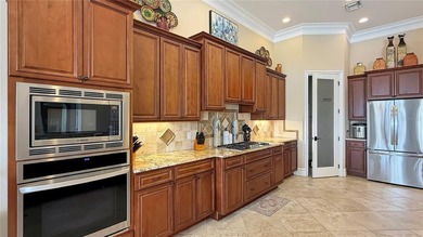 Welcome to an extraordinary Mediterranean-inspired estate on ChampionsGate Golf Resort in Florida - for sale on GolfHomes.com, golf home, golf lot