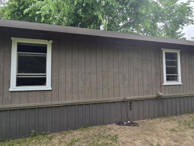 TIRED OF SKY-HIGH RENT? SAY HELLO TO YOUR AFFORDABLE ESCAPE! on Lakes of the North Deer Run Golf Course in Michigan - for sale on GolfHomes.com, golf home, golf lot