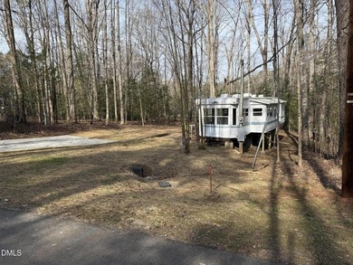 Discover the potential of this unique property located in the on River Golf and Country Club at Lake Royale in North Carolina - for sale on GolfHomes.com, golf home, golf lot