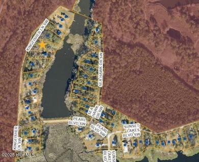 Serenity awaits. This property offers water views and privacy in on Oyster Bay Golf Links in North Carolina - for sale on GolfHomes.com, golf home, golf lot