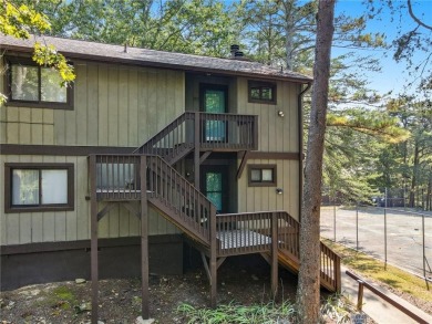 Vacation living at a price you'll love! This lower-level condo on The Highlands Course at Lake Arrowhead in Georgia - for sale on GolfHomes.com, golf home, golf lot