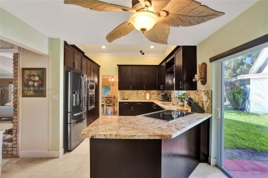 You will fall in love w/ this updated and gorgeous SFH!  3 BR 2 on Woodmont Country Club in Florida - for sale on GolfHomes.com, golf home, golf lot