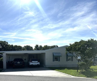 Welcome to Your Spacious Triple-Wide Retreat with Pond Views! on Schalamar Creek Golf and Country Club in Florida - for sale on GolfHomes.com, golf home, golf lot