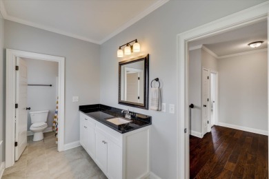 Experience elegant living in this beautifully designed 5-bedroom on Bartram Trail Golf Club in Georgia - for sale on GolfHomes.com, golf home, golf lot