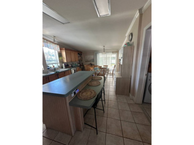 Welcome to Your Spacious Triple-Wide Retreat with Pond Views! on Schalamar Creek Golf and Country Club in Florida - for sale on GolfHomes.com, golf home, golf lot